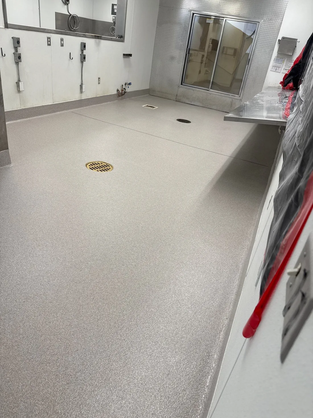 Broadcast flooring system across a food production facility floor