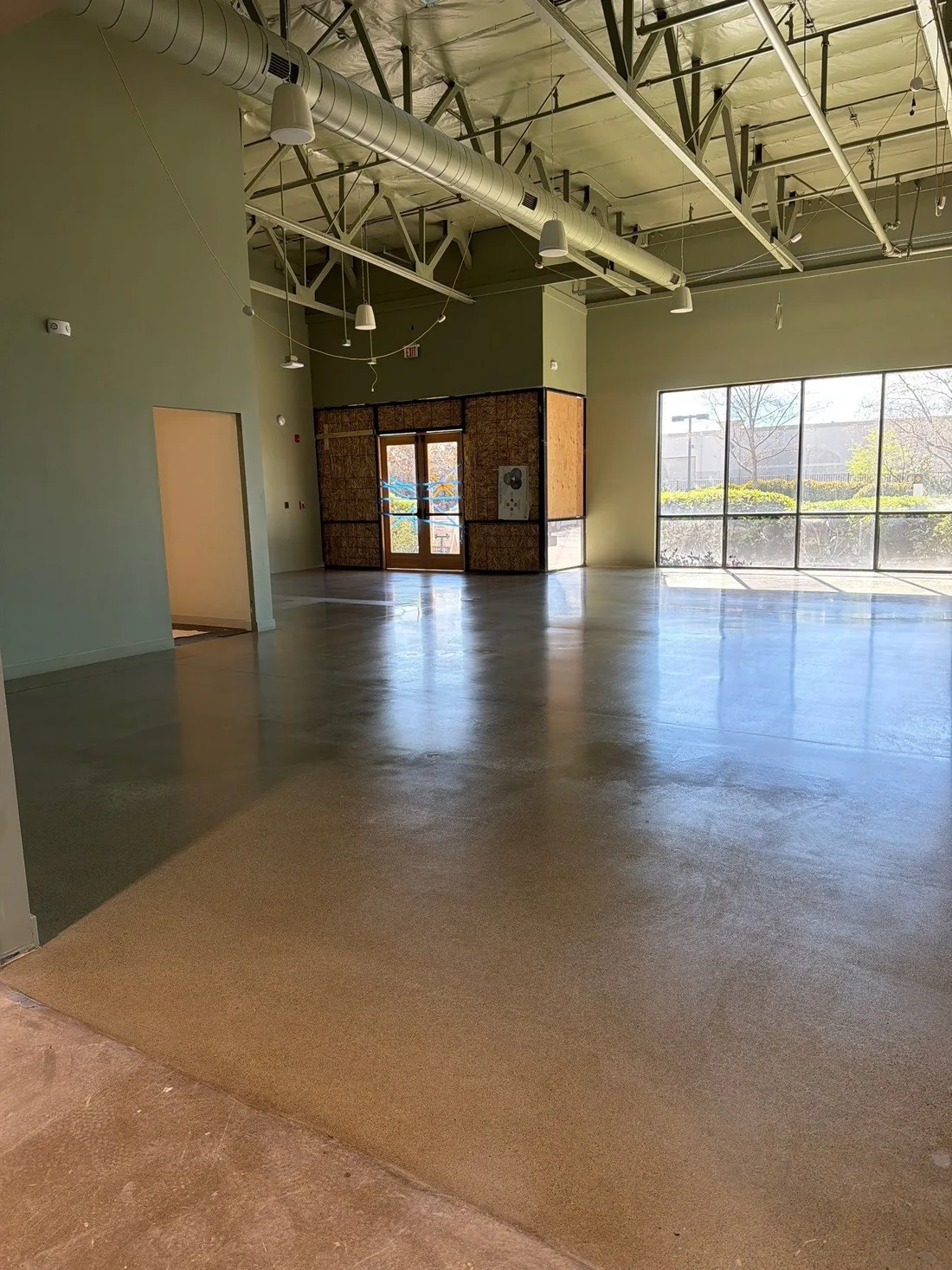 Wide view of a polished concrete floor in a retail showroom